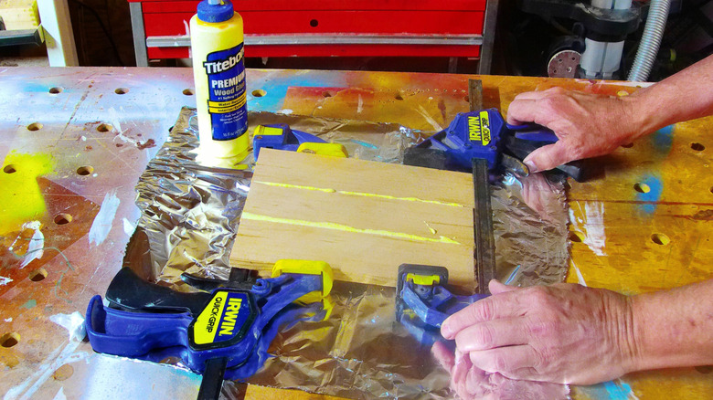Aluminum foil being used to stop glue drips
