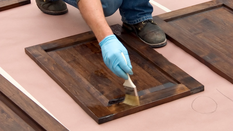 Putting dark stain on prefinished cabinet doors