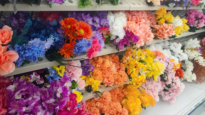 Dollar Tree shelves filled with colorful flowers