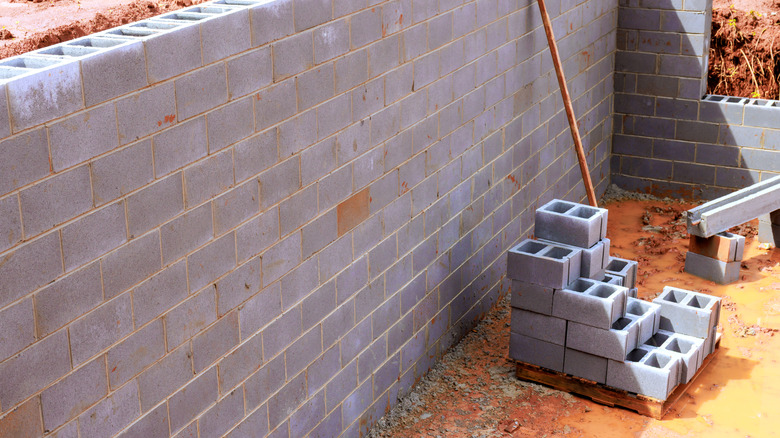 Cinder blocks are used to form walls during construction.