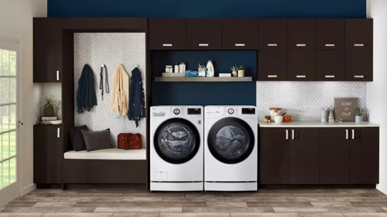 An LG WM4000HWA washer and matching dryer in a laundry room.