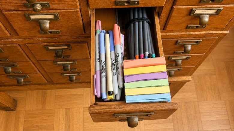 Drawer filled with office supplies