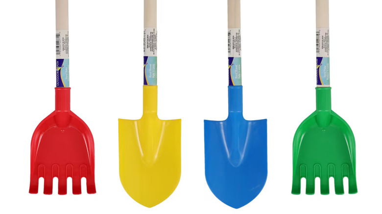colorful plastic shovels with wood handles