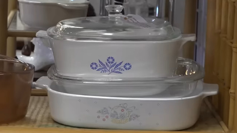Corningware dishes on a thrift store shelf