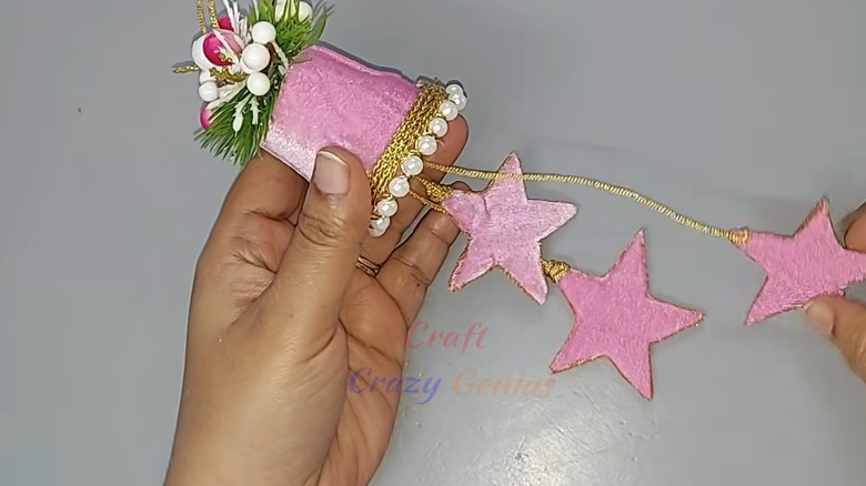 Decorative bell made from liquid laundry detergent cap