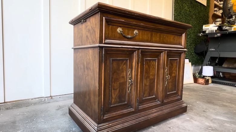 A wooden server from Drexel in a garage