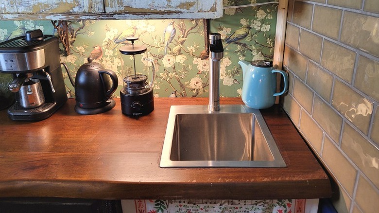 Our bar/prep sink and a curtain hiding the RO filter and other plumbing below