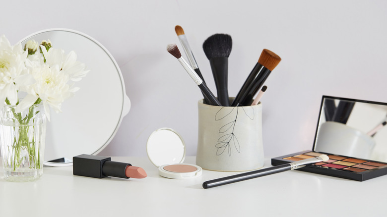 Makeup brushes in cute coffee cup