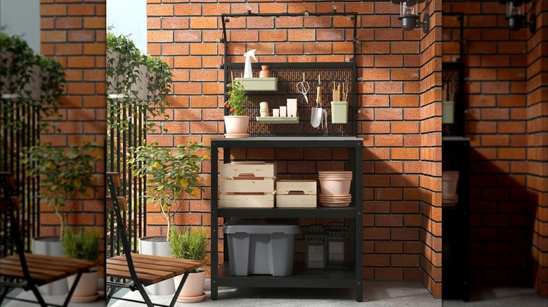 GRILLSKÄR Kitchen island w back panel on balcony used as potting bench