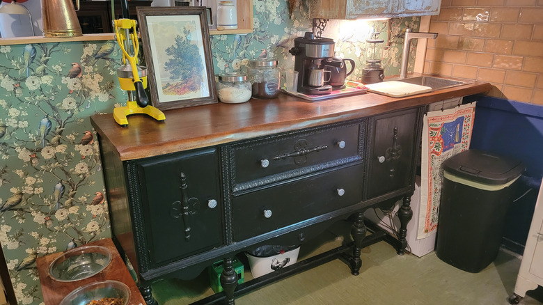 The thrifted buffet in front of its partition wall