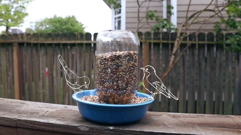 Mason jar and thrifted bowl turned into DIY bird feeder