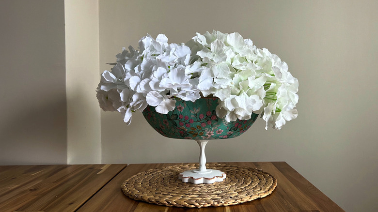 Flower vase made from a decoupaged frying pan and pedestal base