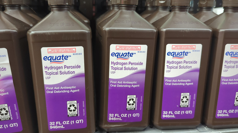 Bottles of topical hydrogen peroxide on a store shelf.