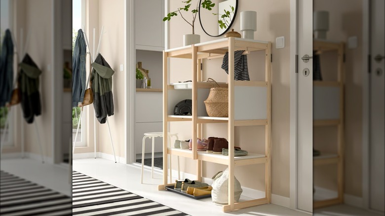 Decor and shoes on an IKEA FLISAT Open Storage Combination in a home's entryway