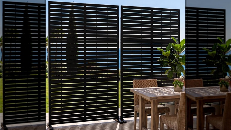 Two free-standing modern FOOWIN privacy shades on a porch