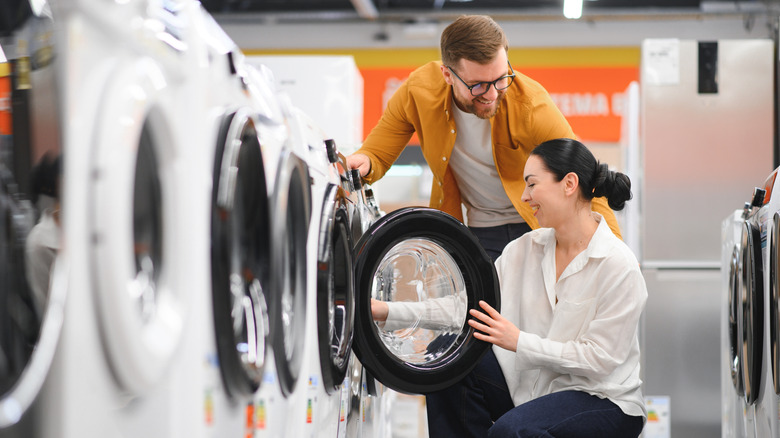 Couple shopping for a washing machine