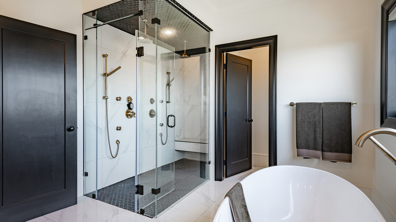 A bathroom with a walk in shower