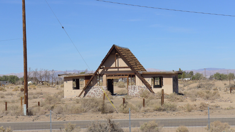 An old A-frame house in poor condition