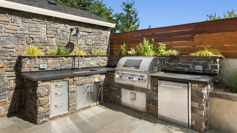 A patio with a gas grill
