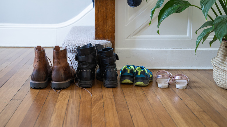 Shoes by the entryway of a home
