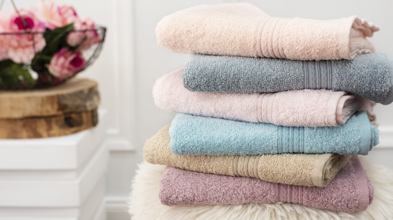 A stack of bath towels with lines