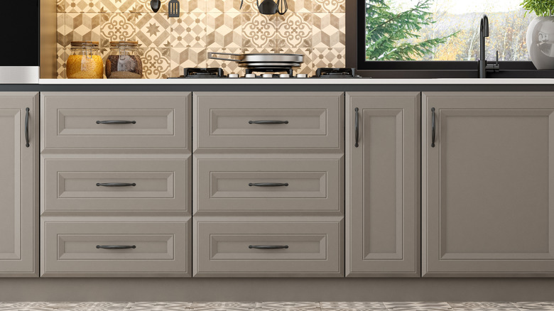 grey lower cabinets in a kitchen