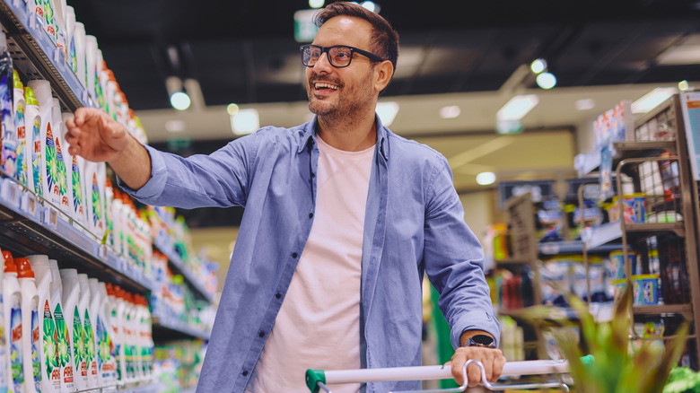 a man browses an aisle in a store