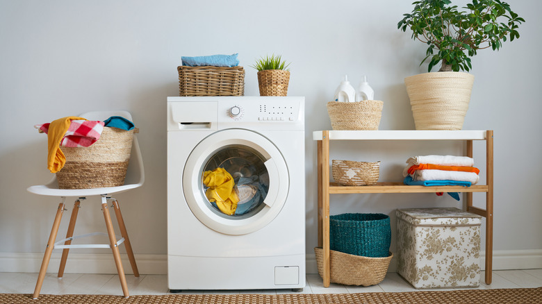 A washing machine in action in a laundry room