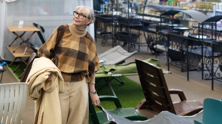 Woman shopping for outdoor furniture in a Costco