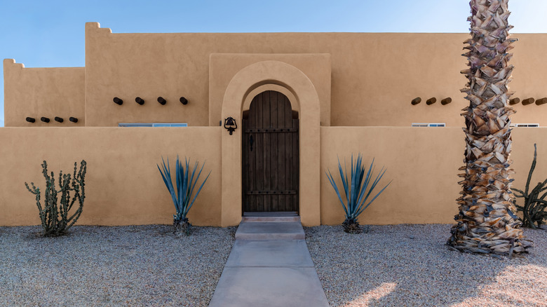 The front facade of an adobe house