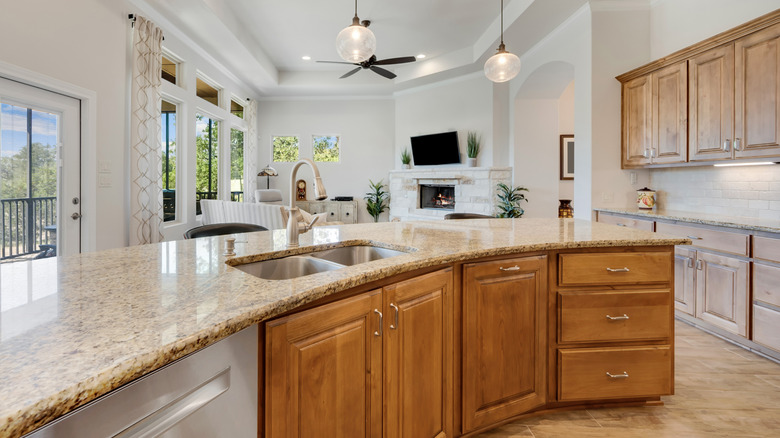 A kitchen with honey oak cabinets