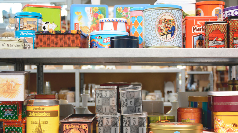 Assorted vintage containers at a thrift store