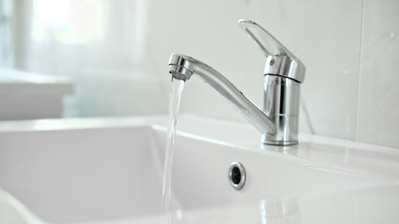Bathroom sink with the faucet running