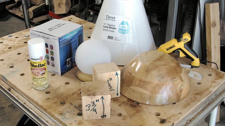 All the components of the bowl lamp on a workshop table