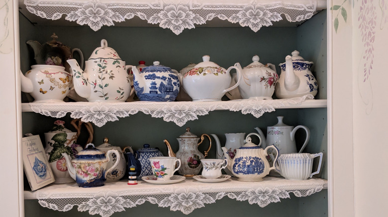 Shelves full of vintage china in a thrift store