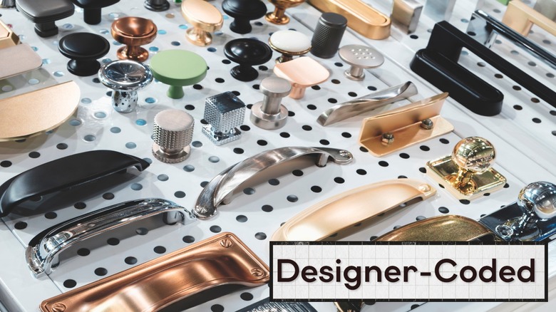 pegboard full of cabinet hardware options such as knobs and pulls