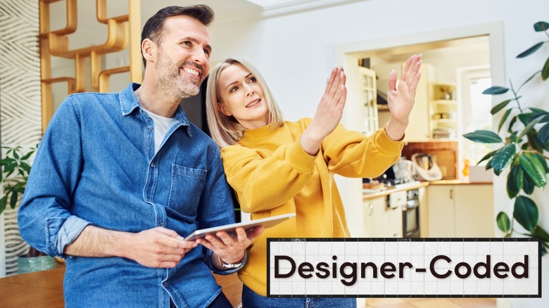 Two people discussing the design of a room