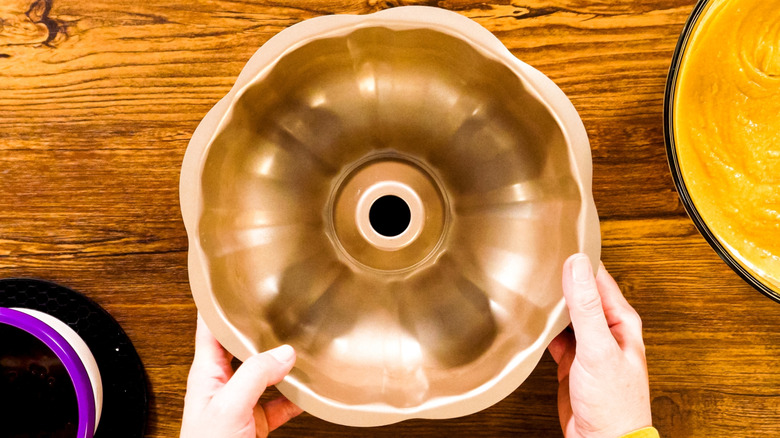Birds' eye view of a person holding a Bundt pan
