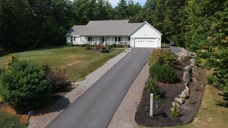 a long dull asphalt driveway