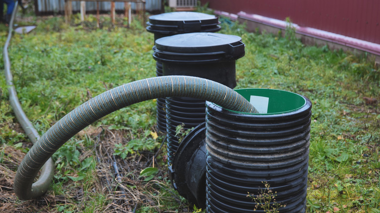 Pumping from septic tank risers on a lawn