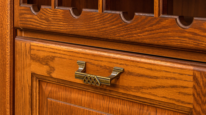 an old orange hued oak cabinet