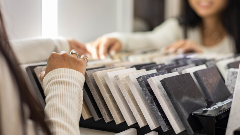 Woman choosing stone tile options