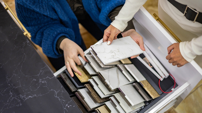 two people picking out countertop materials together
