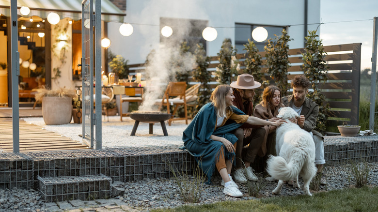 A group of people hanging out on a decorated patio