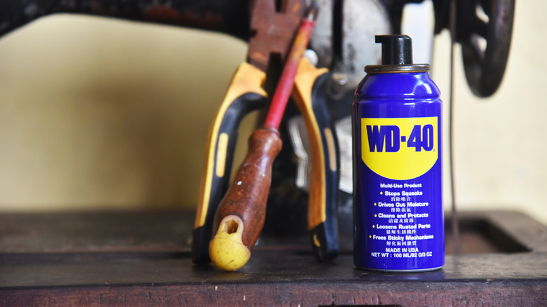 A can of WD-40 on a workshop table