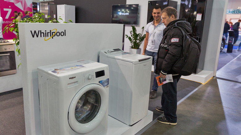 People looking at whirlpool appliances
