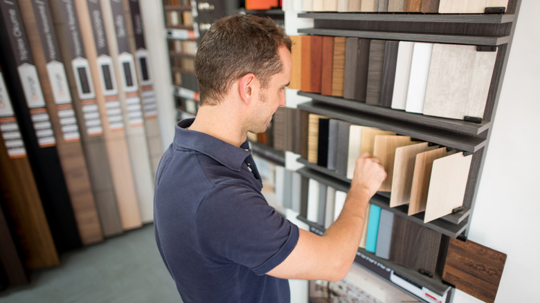 Man looking at flooring samples