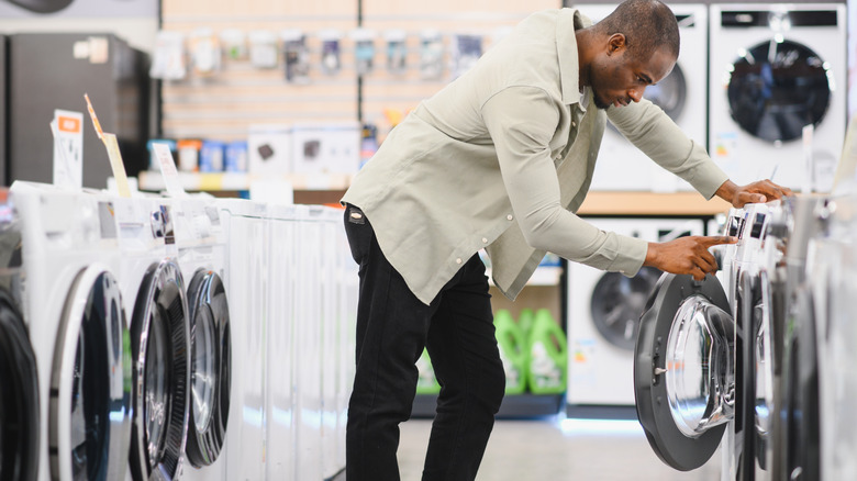A person looking at a dryer in a store