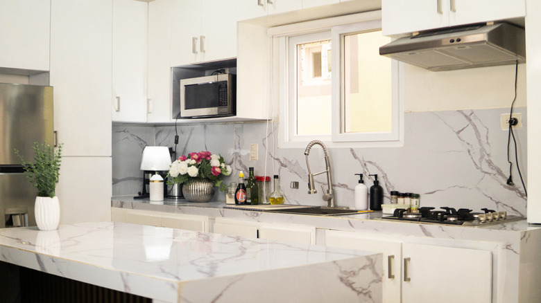 A kitchen with a quartz island and countertops