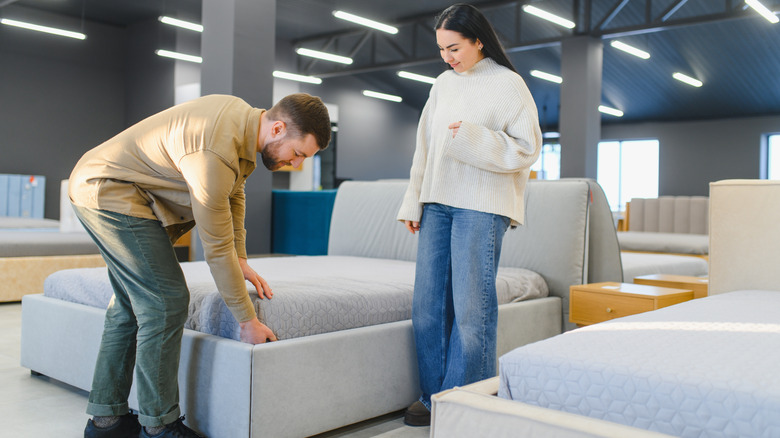 people shopping for bed